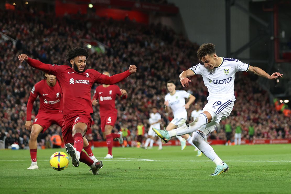 Rodrigo Moreno shoots while under pressure from Liverpool's Joe Gomez.
