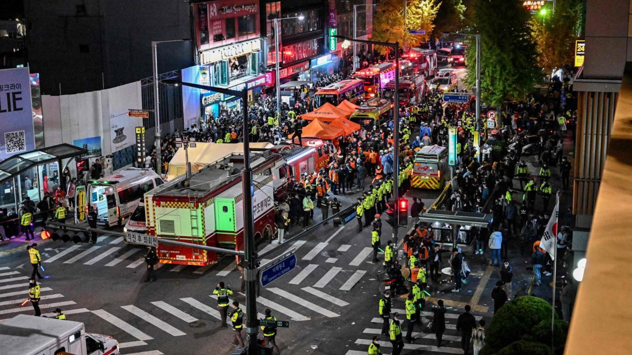 Onlookers, police and paramedics gather in the popular nightlife district of Itaewon in Seoul on October 30, 2022.