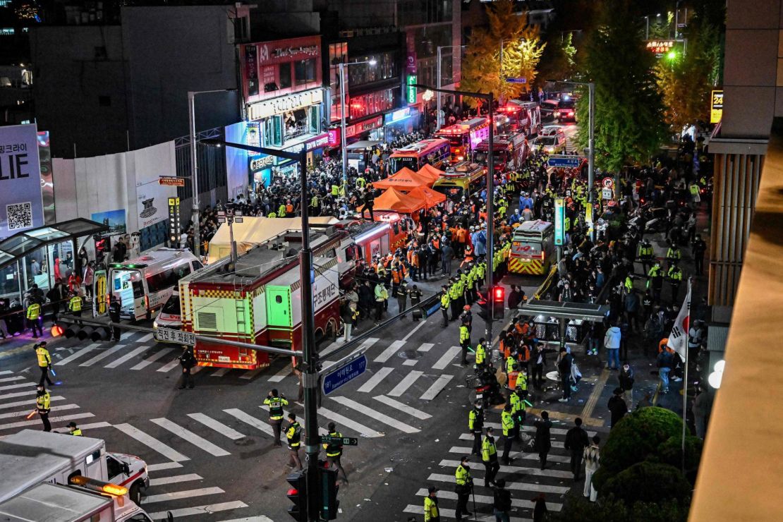 Onlookers, police and paramedics gather in the popular nightlife district of Itaewon in Seoul on October 30, 2022.