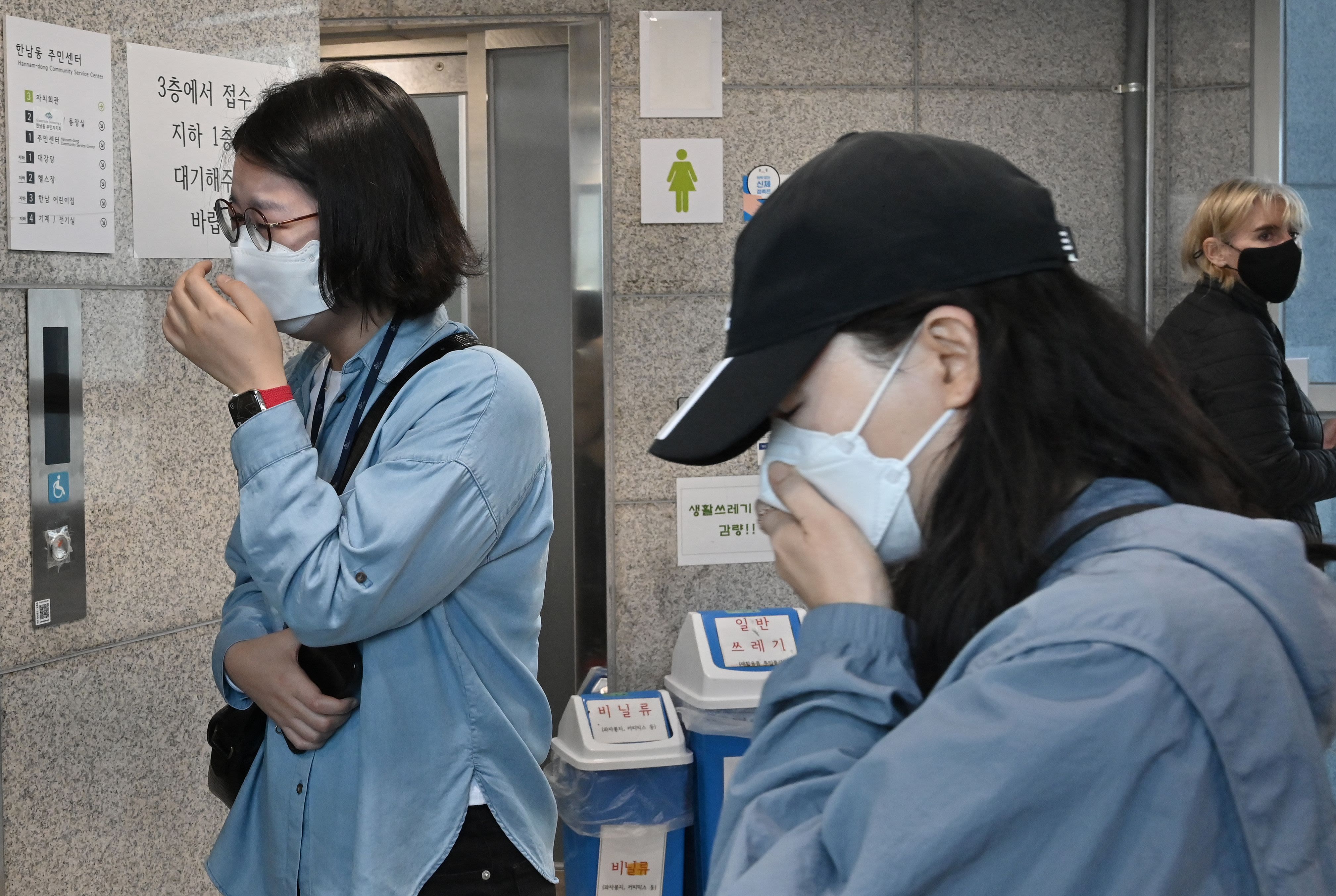 Relatives of missing persons wait for updates at the Hannam-dong Community Center in Seoul.