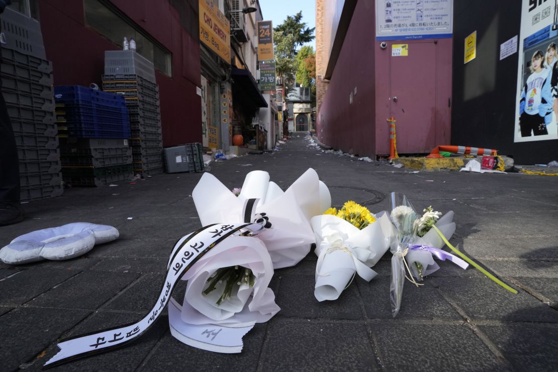 Flowers are seen at the scene of a deadly accident in Seoul, South Korea, Sunday, Oct. 30, 2022.