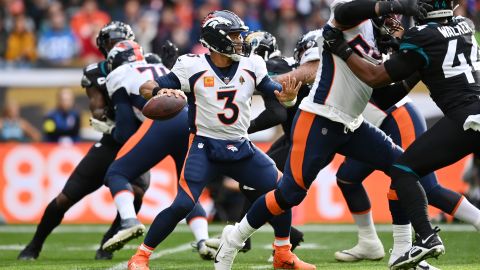 Wilson looks to throw a pass in the first half against the Jaguars.