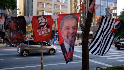 Towels with pictures of both presidential candidates were hung nearby on Av Paulista in Sao Paulo on Sunday.