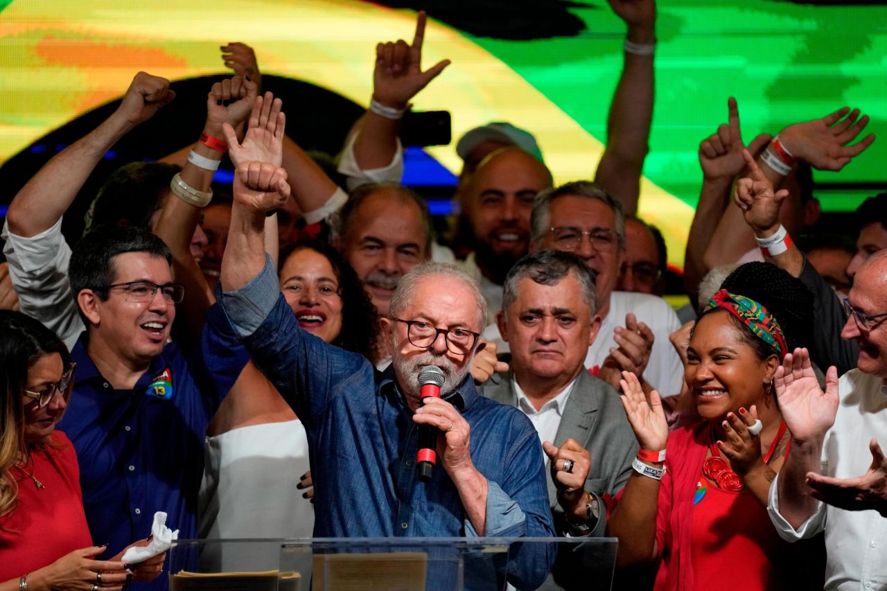 Luiz Inacio Lula da Silva raises his fist after addressing supporters in Sao Paulo, Brazil, on Sunday, October 30.