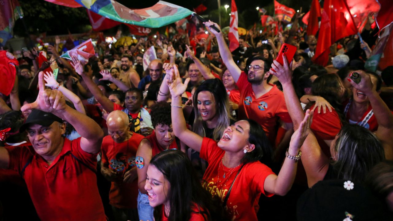 Supporters of Lula da Silva react as they gather on the day of the Brazilian presidential election run-off, in Brasilia, Brazil October 30, 2022.