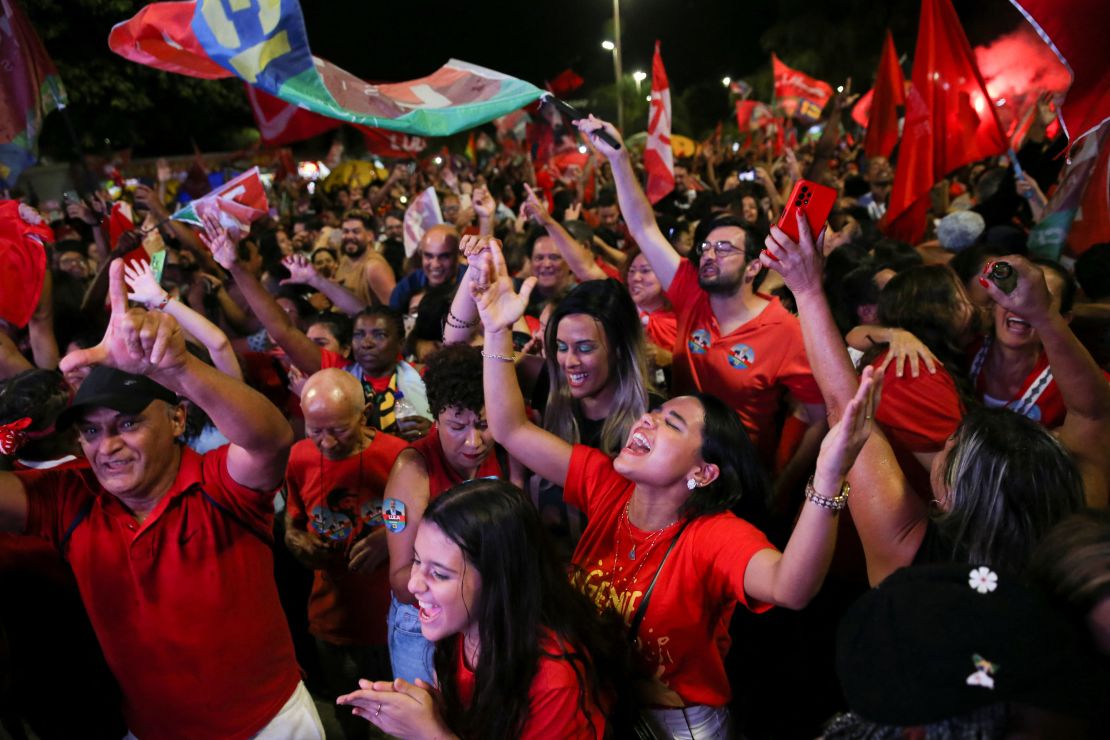 Supporters of Lula da Silva react as they gather on the day of the Brazilian presidential election run-off, in Brasilia, Brazil October 30, 2022.