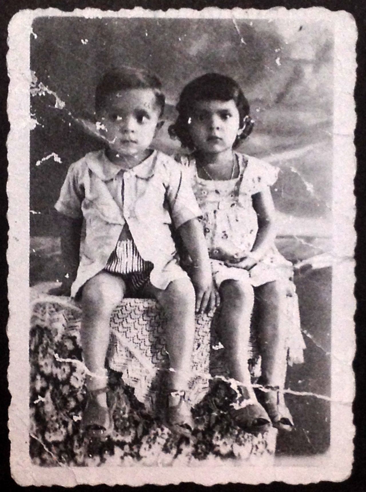 Lula sits for a picture with his sister in 1949.