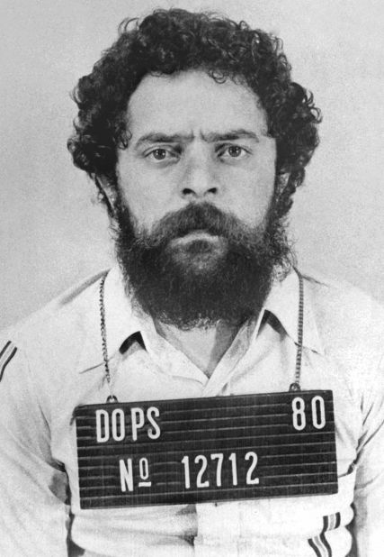 Lula poses for a mugshot in 1980 after being arrested for organizing a metalworkers union strike. He spent 31 days in jail. 