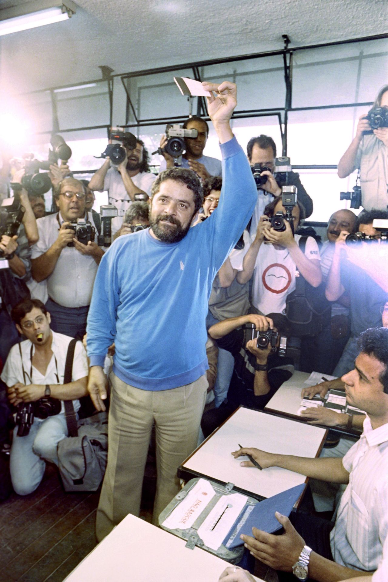 As a first-time presidential candidate, Lula displays his vote before placing it in a ballot box in Rio de Janeiro in 1989. Lula ran in Brazil's first democratic elections since 1960.
