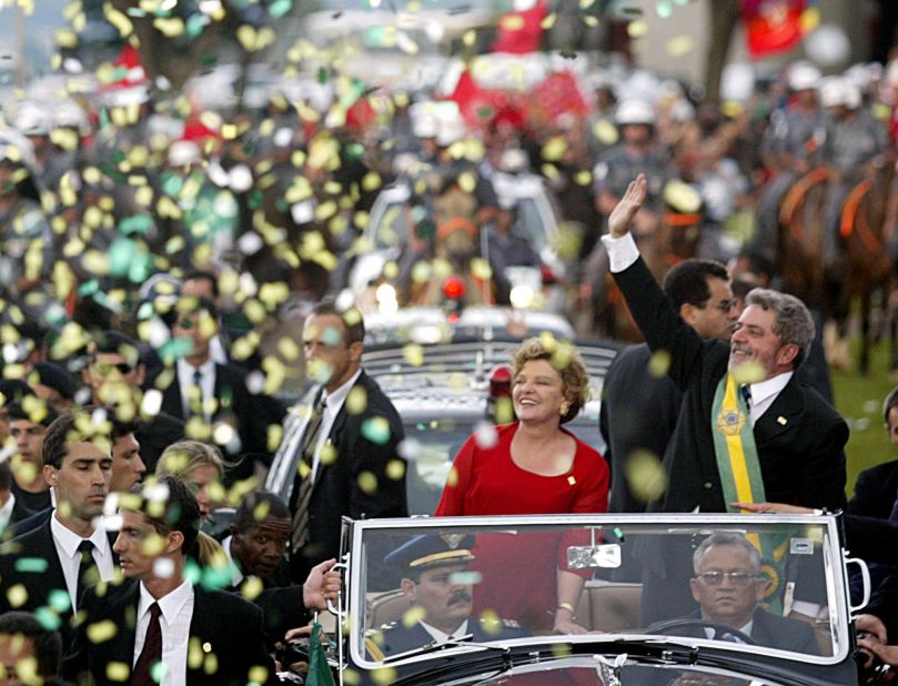 Lula waves to supporters with his wife Marisa after he received the presidential sash at his inauguration in Brasília in 2003.