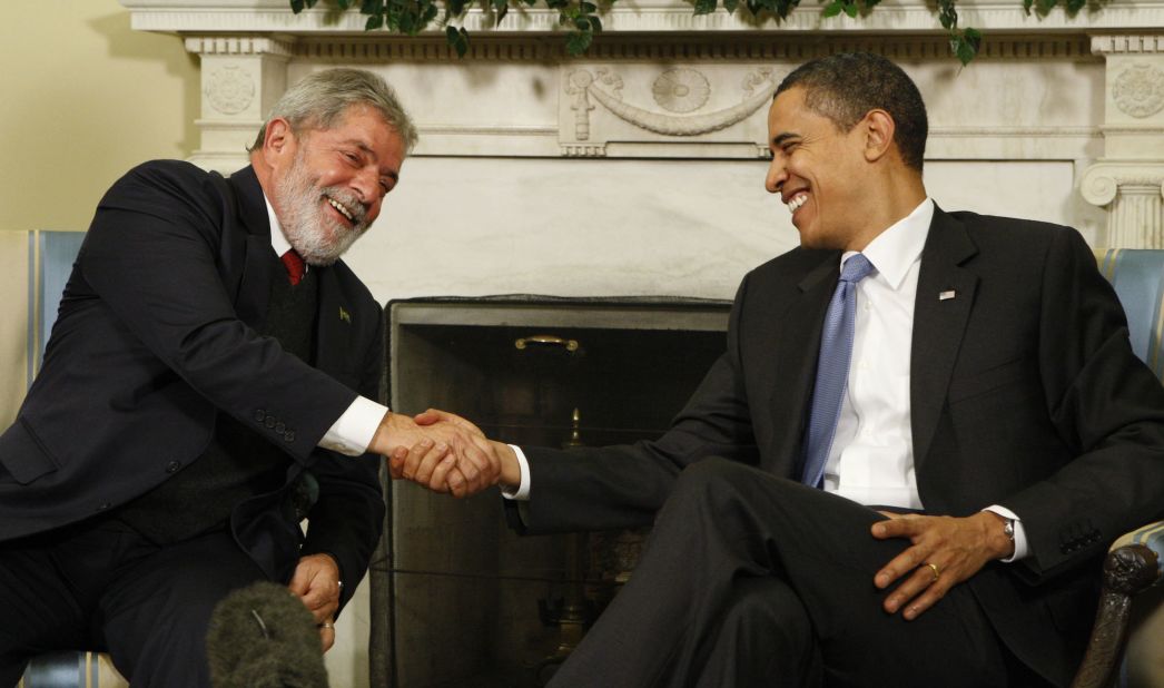 President Barack Obama greets Lula during their meeting in the Oval Office of the White House in 2009.