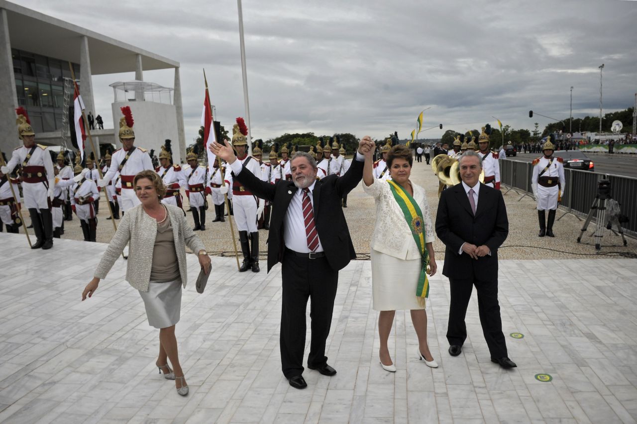 Outgoing President Lula da Silva and his wife Marisa leave the Planalto Palace with newly sworn-in Brazilian President Dilma Rousseff and Vice President Michel Temer in Brasilia in 2011. Rousseff beat opposition candidate Jose Serra in a run-off election to become the South American nation's first female president.