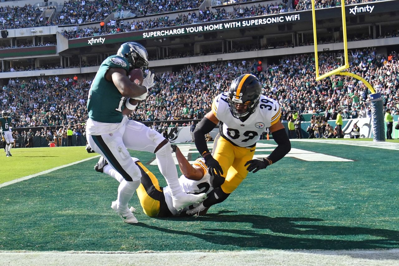 Philadelphia Eagles wide receiver A.J. Brown catches a 29-yard touchdown pass against Pittsburgh Steelers cornerback Ahkello Witherspoon and safety Minkah Fitzpatrick. Brown caught three touchdown passes as the Eagles remained undefeated with a 35-13 victory over the Steelers to move to 7-0 for the season. 