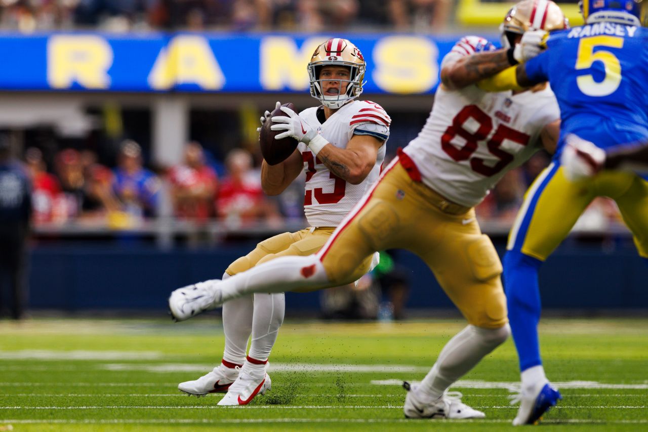 San Francisco 49ers running back Christian McCaffrey throws a touchdown pass to Brandon Aiyuk against the Los Angeles Rams. McCaffrey equaled a rare record in the 49ers 31-14 victory, becoming the first NFL player since Hall of Famer LaDainian Tomlinson in 2005 to have a passing, rushing and receiving touchdown in a game. 