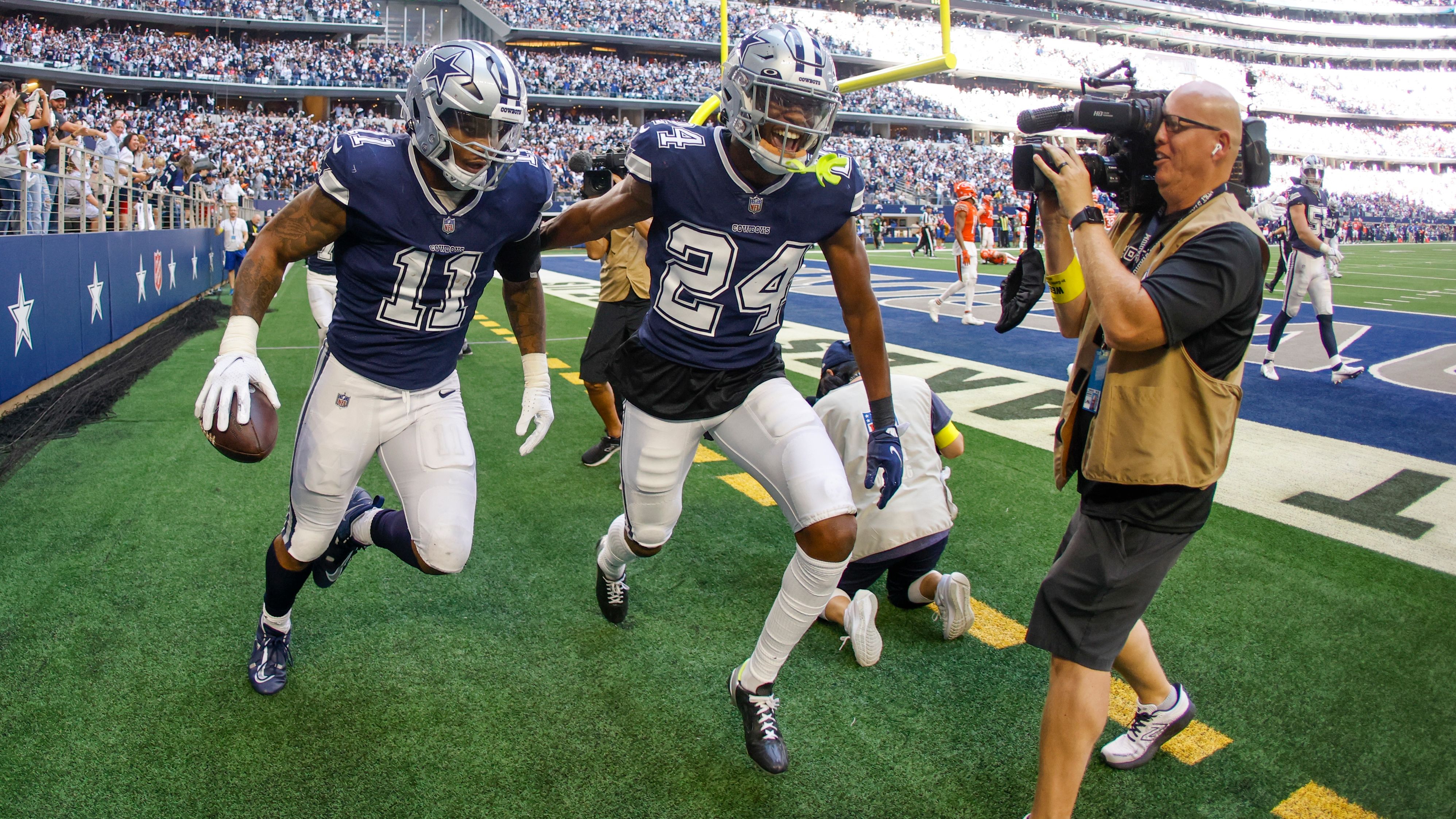 Dallas Cowboys' Micah Parsons celebrates his fumble recovery and touchdown run during the second half against the Chicago Bears. The Cowboys dominated the Bears, winning 49-29, with running back Tony Pollard scoring three rushing touchdowns. 