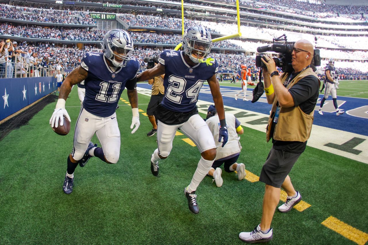 Dallas Cowboys' Micah Parsons celebrates his fumble recovery and touchdown run during the second half against the Chicago Bears. The Cowboys dominated the Bears, winning 49-29, with running back Tony Pollard scoring three rushing touchdowns. 