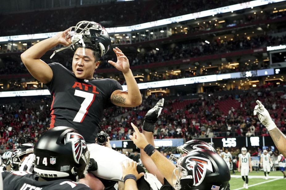 Atlanta Falcons kicker<a href="https://edition.cnn.com/2022/09/11/sport/younghoe-koo-atlanta-falcons-nfl-spt-intl/index.html" target="_blank"> Younghoe Koo</a> is congratulated by teammates after kicking the game-winning field goal in overtime against the Carolina Panthers. Regular time ended in dramatic fashion after Panthers quarterback PJ Walker completed a huge Hail Mary touchdown pass to tie the scores but kicker Eddy Pineiro missed two key kicks which would have given Carolina the victory. In the end, Koo's overtime field goal gave the Falcons the 37-34 victory. 