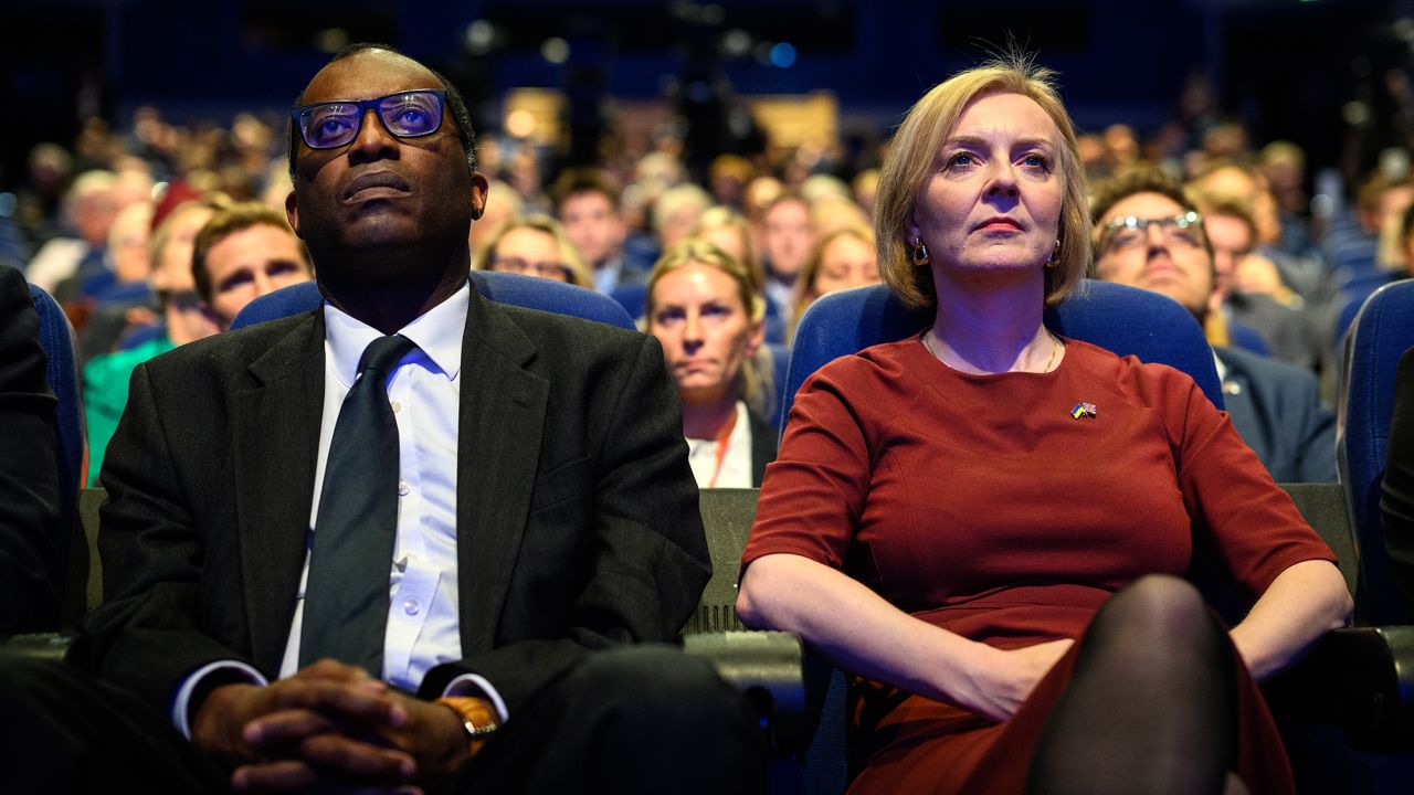 The UK's former finance minister Kwasi Kwarteng and former Prime Minister Liz Truss at the Conservative Party conference on October 02, 2022 in Birmingham, England. 
