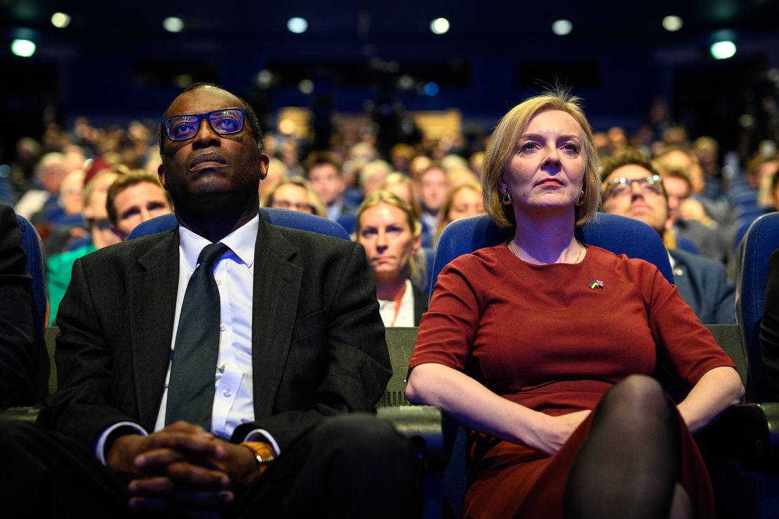 The UK's former finance minister Kwasi Kwarteng and former Prime Minister Liz Truss at the Conservative Party conference on October 02, 2022 in Birmingham, England. 