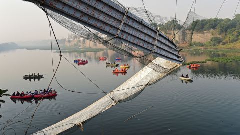 Rescue personnel conduct search operations in Morbi, October 31, 2022.