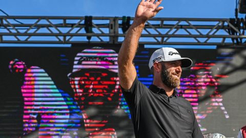 Dustin Johnson, captain of 4Aces, celebrates his team's victory onstage after the 2022 LIV Golf Invitational Miami at Trump National Doral in Florida.