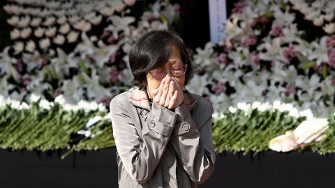 A woman makes a memorial service at an altar in Seoul, South Korea, October 31.