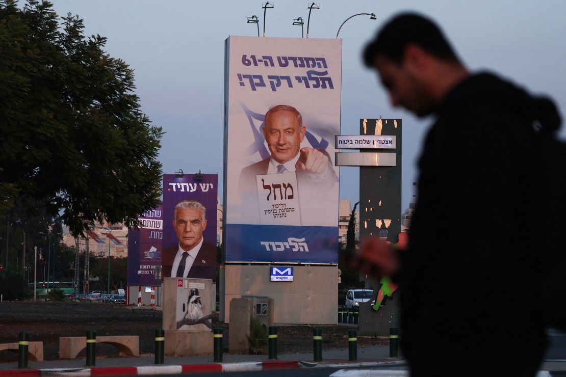 A picture shows an electoral banner for the Likud party depicting Netanyahu in Tel Aviv on October 27.