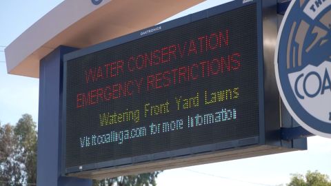 A sign from the city of Coalinga warns residents against watering their lawns amid the drought.