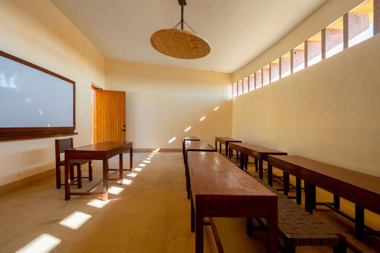 High ceilings and windows help release trapped heat in classrooms.