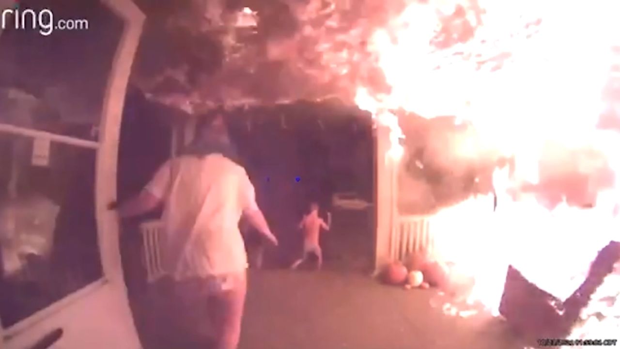 Video doorbell footage shows flames spreading across the porch of a home in Red Oak, Iowa on October 23 as occupants of the house run into the yard.