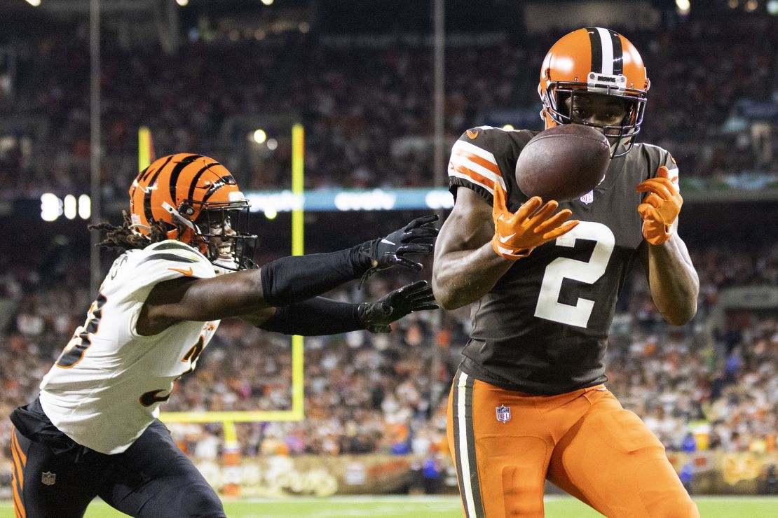Cooper catches the ball for a touchdown while defended by Bengals cornerback Tre Flowers during the third quarter.