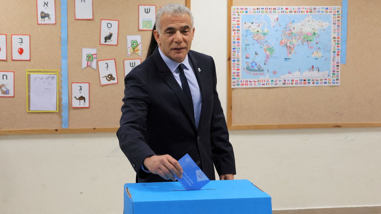 Acting Prime Minister Yair Lapid casts his vote at a polling station in Tel Aviv on November 1, 2022. 
