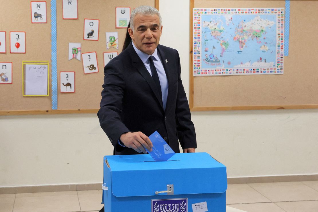 Acting Prime Minister Yair Lapid casts his vote at a polling station in Tel Aviv on November 1, 2022. 