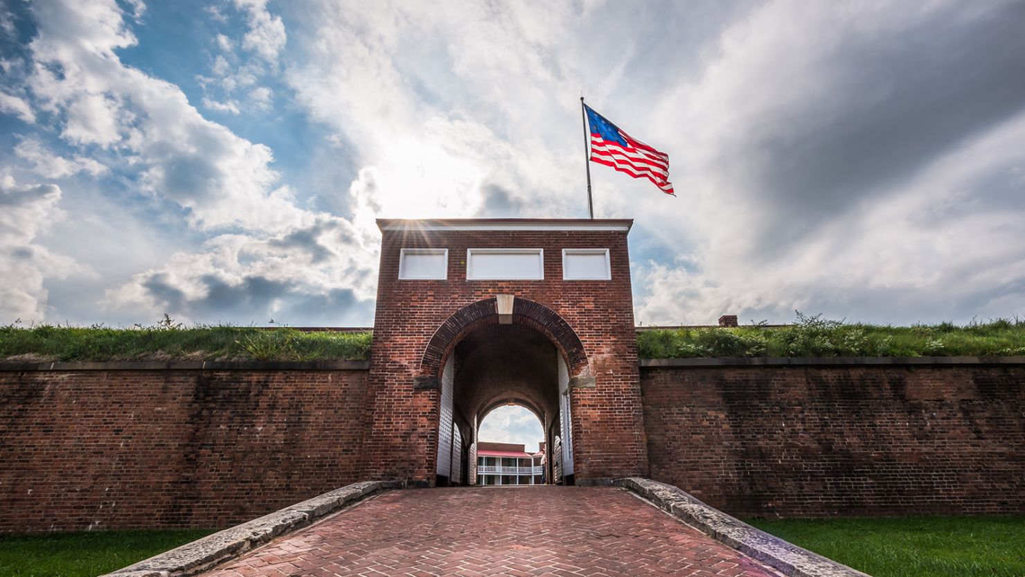 Historic American flying over the entrance to Fort McHenry National Monument, Baltimore, Maryland