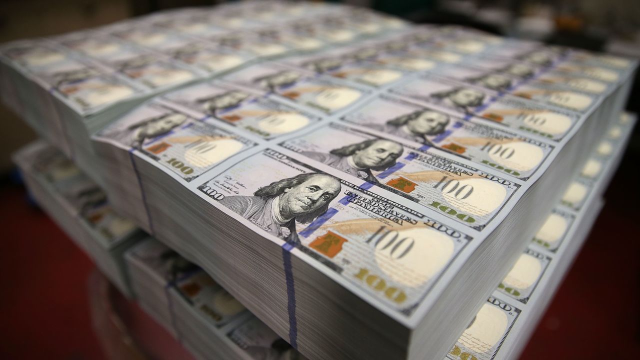 WASHINGTON, DC - MAY 20: Newly redesigned $100 notes lay in stacks at the Bureau of Engraving and Printing on May 20, 2013 in Washington, DC. The one hundred dollar bills will be released this fall and has new security features, such as a duplicating portrait of Benjamin Franklin and microprinting added to make the bill more difficult to counterfeit.  (Photo by Mark Wilson/Getty Images)