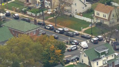 A heavy police presence is seen at a residential building in the area of Chancellor Avenue and Van Velsor Place in Newark, New Jersey, on Tuesday.