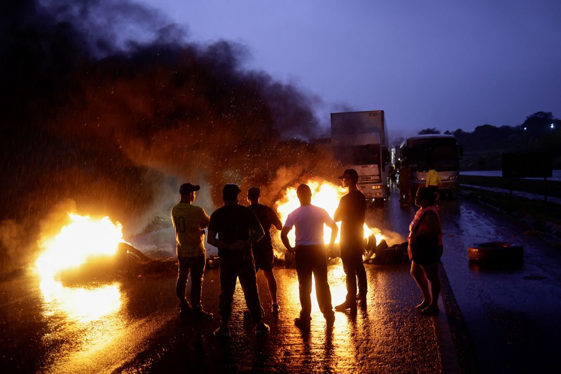 Supporters of Brazil's President Jair Bolsonaro blocking a highway near Abadiania, central Brazil.