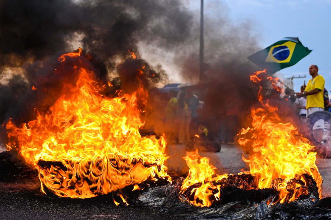 A protester in Varginha, Minas Gerais state, waves a Brazilian flag.