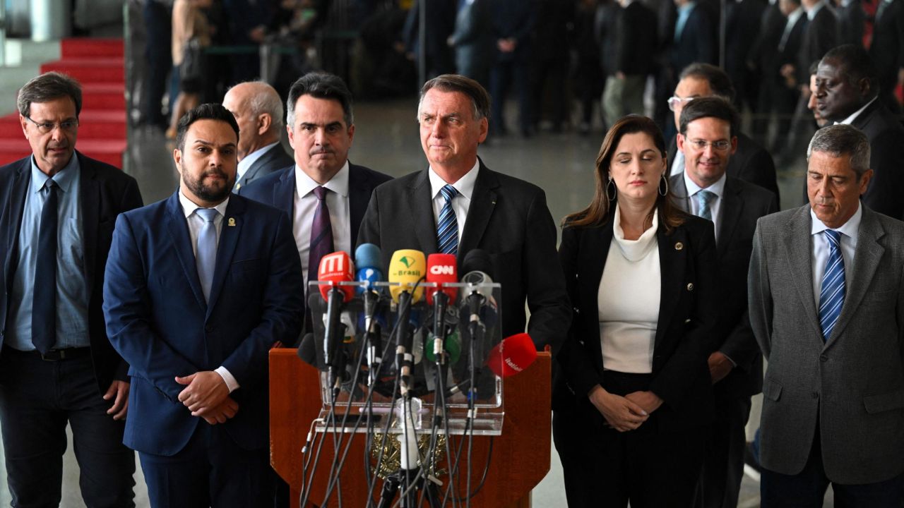 Brazilian President Jair Bolsonaro (C) makes a statement for the first time since Sunday's presidential run-off election, at Alvorada Palace in Brasilia, on November 1, 2022. - Brazil's Bolsonaro sais will 'comply' with constitution after poll loss. (Photo by EVARISTO SA / AFP) (Photo by EVARISTO SA/AFP via Getty Images)