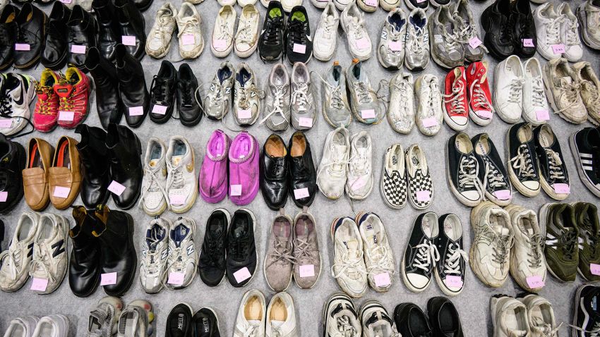 Shoes retrieved by police from the scene of a fatal Halloween crowd surge that killed more than 150 people in the Itaewon district are displayed at a gymnasium for relatives of victims to collect, in Seoul on November 1, 2022.