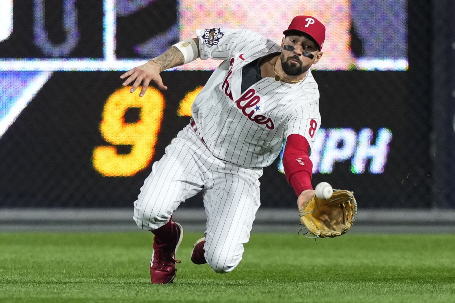 Philadelphia right fielder Nick Castellanos makes a diving catch on the first play of Game 3 on Tuesday night.