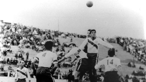 American players compete for a header against England. 