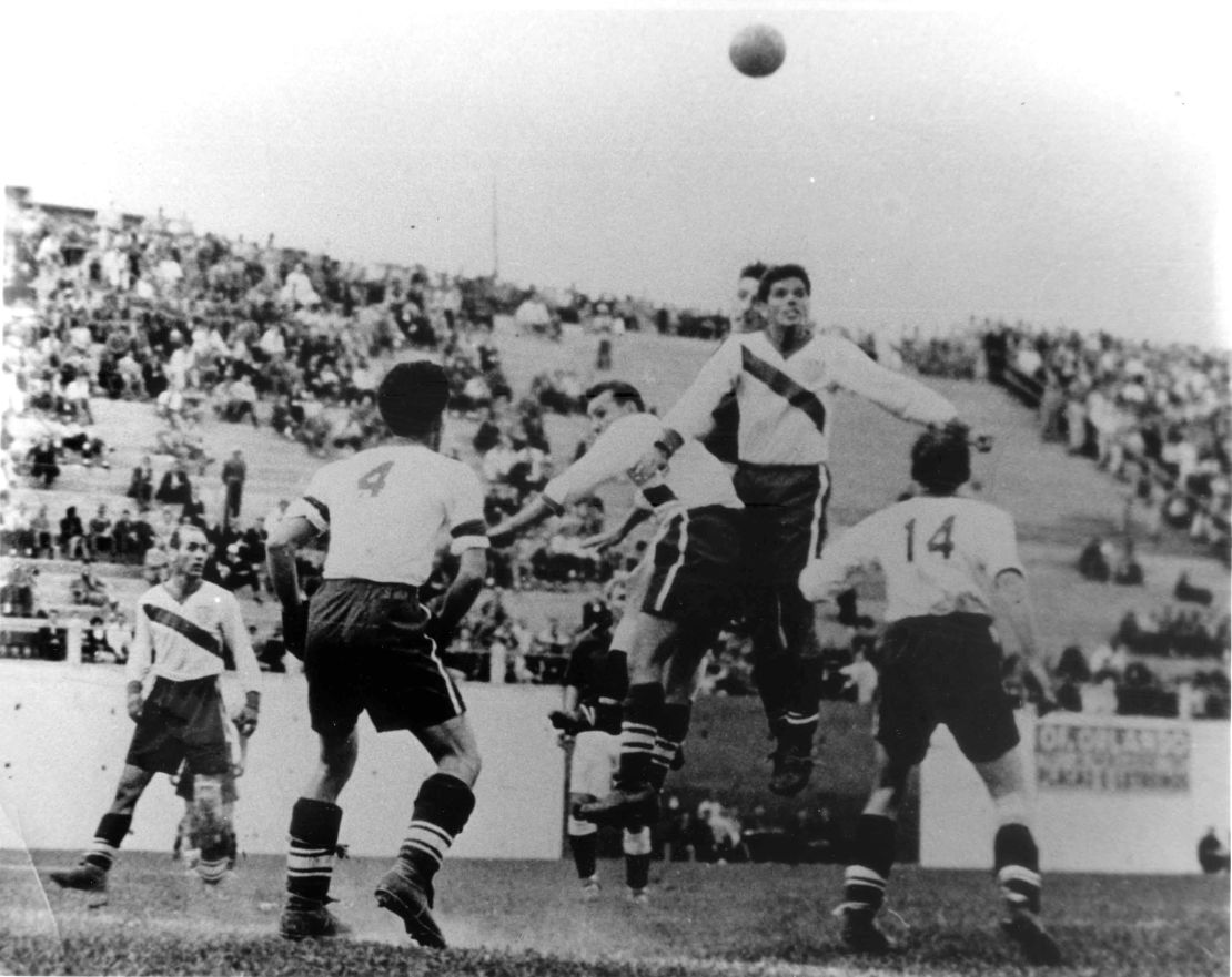 US players challenge for a header against England. 