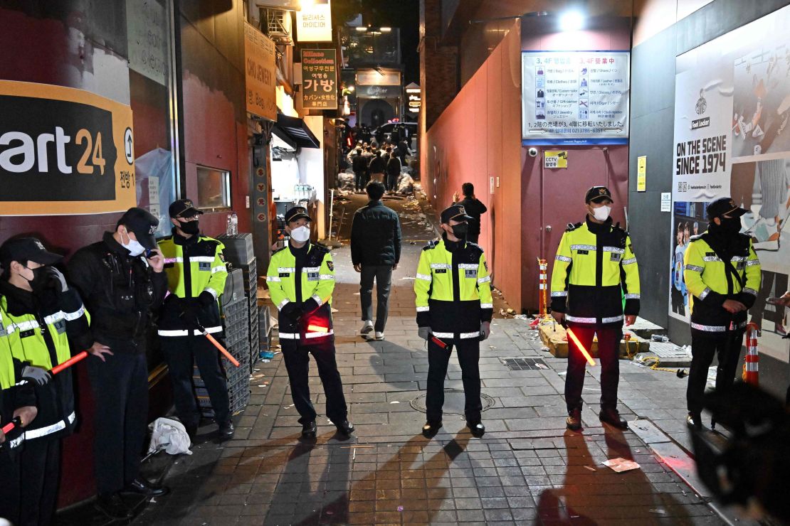 Police stand guard at the scene of the crowd crush in Itaewon, Seoul, South Korea, on October 30.