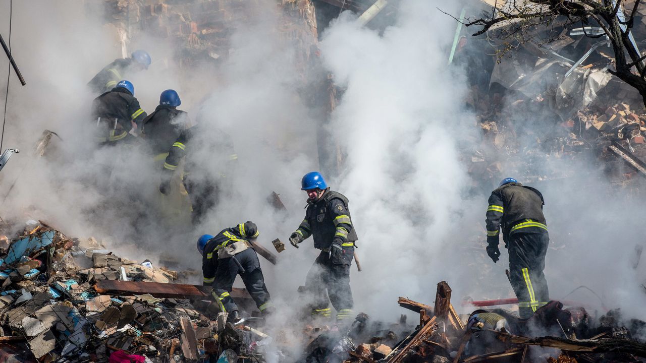 Ukrainian rescuers work at a residential building destroyed by a Russian drone strike, which local authorities consider to be Iranian-made,   in Kyiv October 17. 