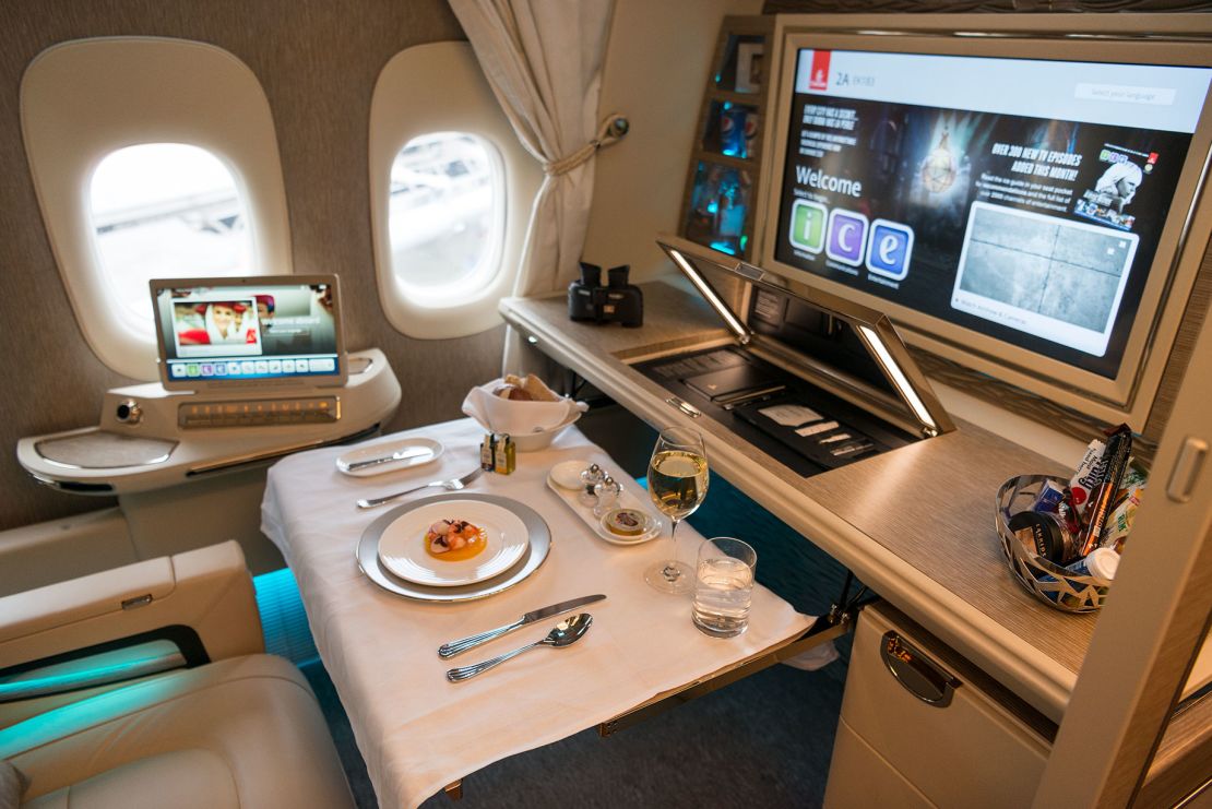 On Emirates, high-wall first-class suites offer privacy for dining, sleeping, working and entertainment.