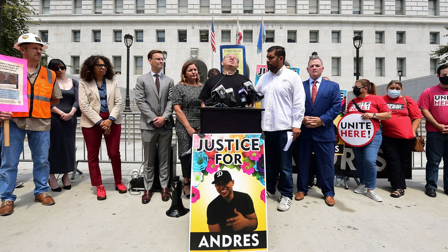 Cristobal Guardado, Andres' father, stands at a podium during a rally demanding justice for his son's killing in Los Angeles on June 18, 2021. 
