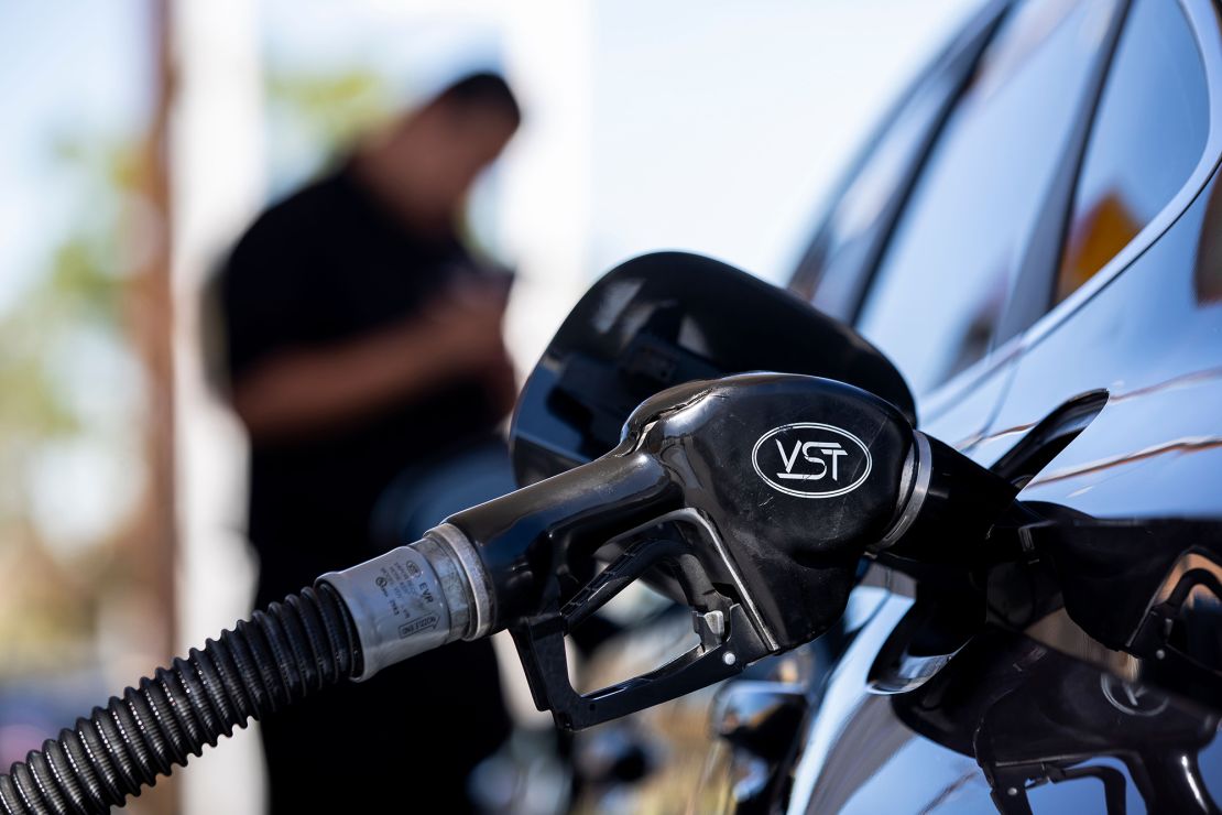 A man refuels his car at gas station in Carson, California, on September 22.