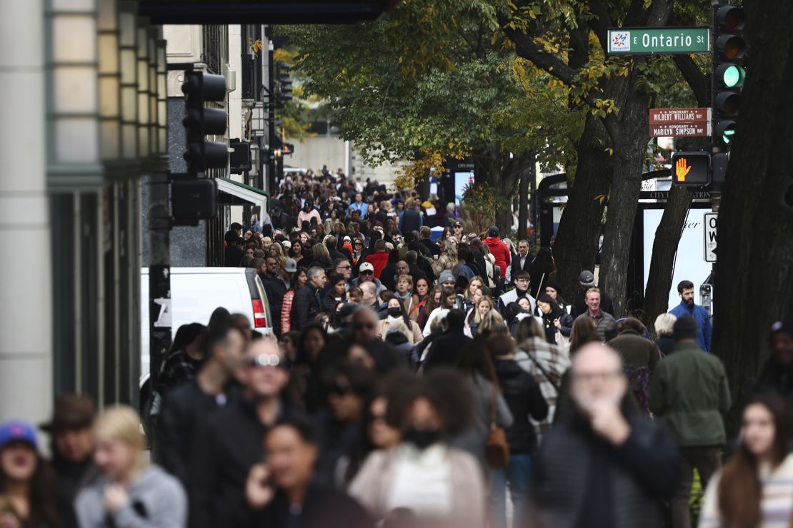 People walk in Chicago, IL, on October 14.