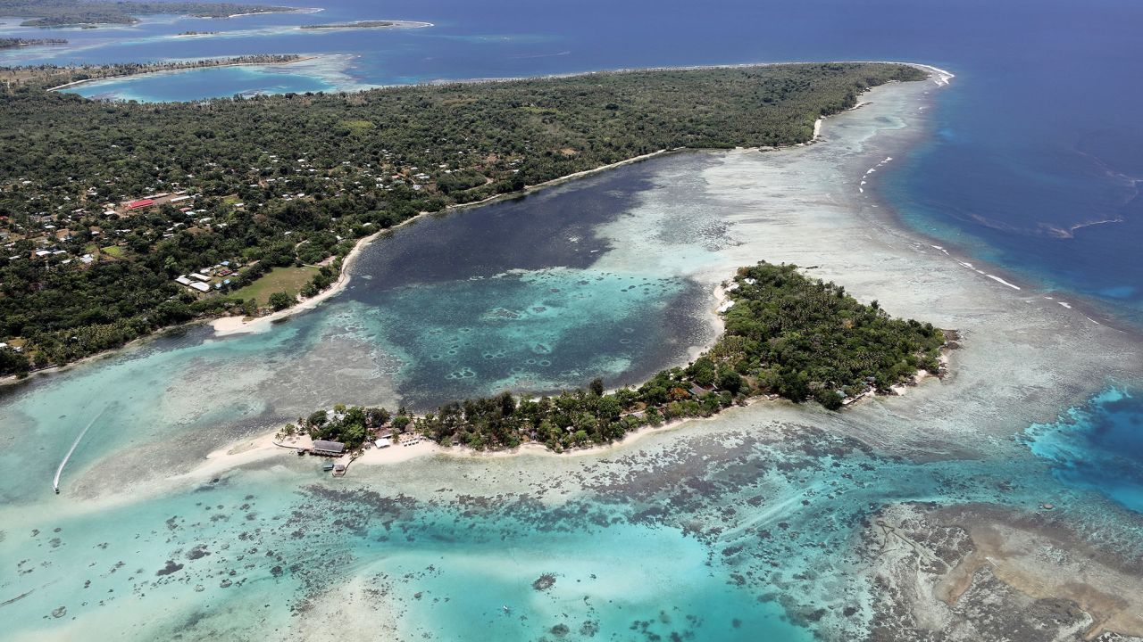 PORT VILA, VANUATU - DECEMBER 07: An aerial view of Erakor island and the coastline of Port Vila on December 07, 2019 in Port Vila, Vanuatu.  Satellite data show sea level has risen about 6mm per year around Vanuatu since 1993, a rate nearly twice the global average, while temperatures have been increasing since 1950. 25 percent of Vanuatu's 276,000 citizens lost their homes in 2015 when Cyclone Pam, a category 5 storm, devastated the South Pacific archipelago of 83 islands while wiping out two-thirds of its GDP. Scientists have forecast that the strength of South Pacific cyclones will increase because of global warming. Vanuatu's government is considering suing the world's major pollution emitters in a radical effort to confront global warming challenges and curb global emissions, to which it is a very small contributor. Last year, the country banned single use plastic bags, styrofoam food containers and drinking straws in an effort to contain pollution and set an example to larger nations. (Photo by Mario Tama/Getty Images)